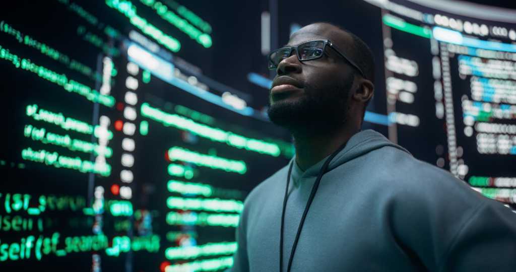 Designing the agent-ready data stack Portrait of Worried Professional Programmer Fixing a Bug, Dealing with Crashing System. Young Black Man Looking at Big Digital Screens Glitching While Displaying Code Lines, Thinking of Solutions