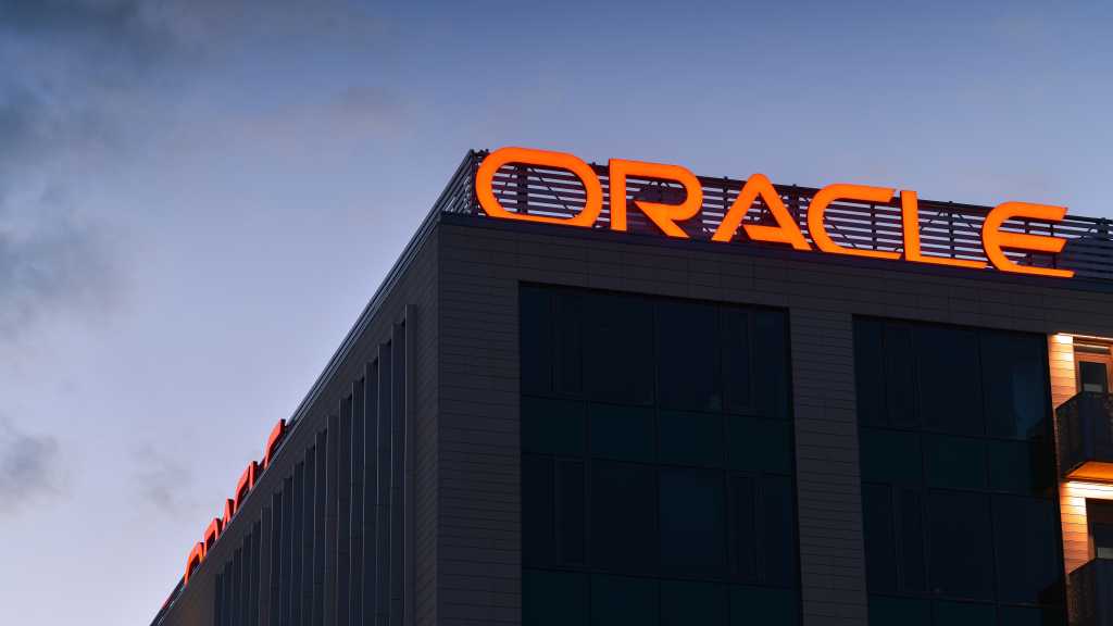 Here’s what Oracle’s soaring infrastructure spend could mean for enterprises Oracle logo on building