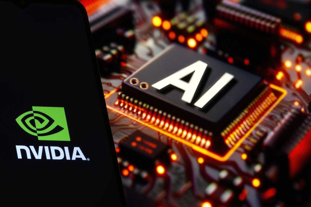 Nvidia bets on open infrastructure for the agentic AI era with Nemotron 3 NVIDIA logo on phone and blurred AI chip on the background, USA, February 15, 2024