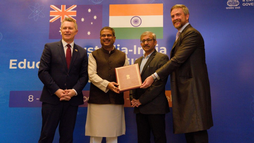 UNSW Sydney to set up India campus in Bengaluru by August 2026 L-R: Australian MP Jason Clare, Union Minister of Education Dharmendra Pradhan, hands over LOI to Prof Atilla Brungs of UNSW Sydney (Photo via UNSW)