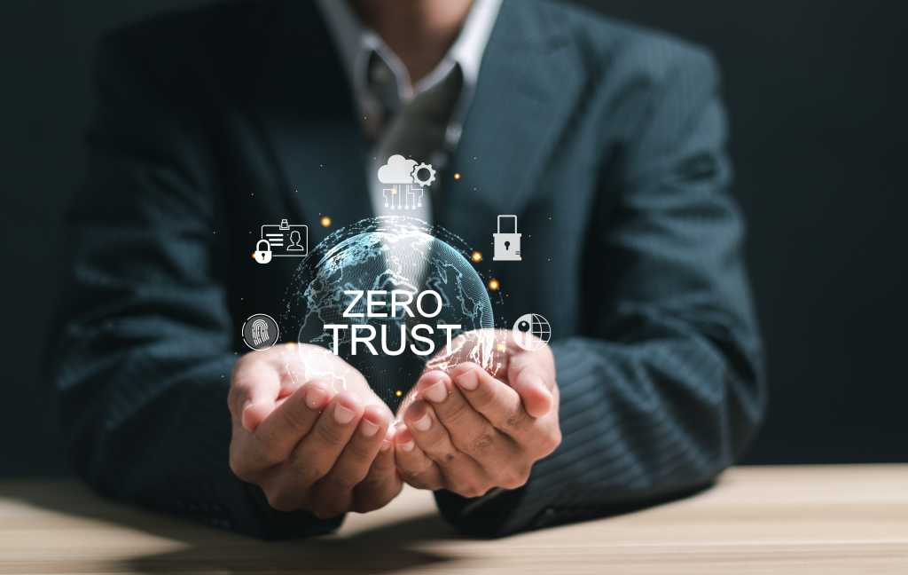 Zero-trust data governance needed to protect AI models from slop Zero trust security concept, Businessman holding virtual zero trust icon for business information security network.
