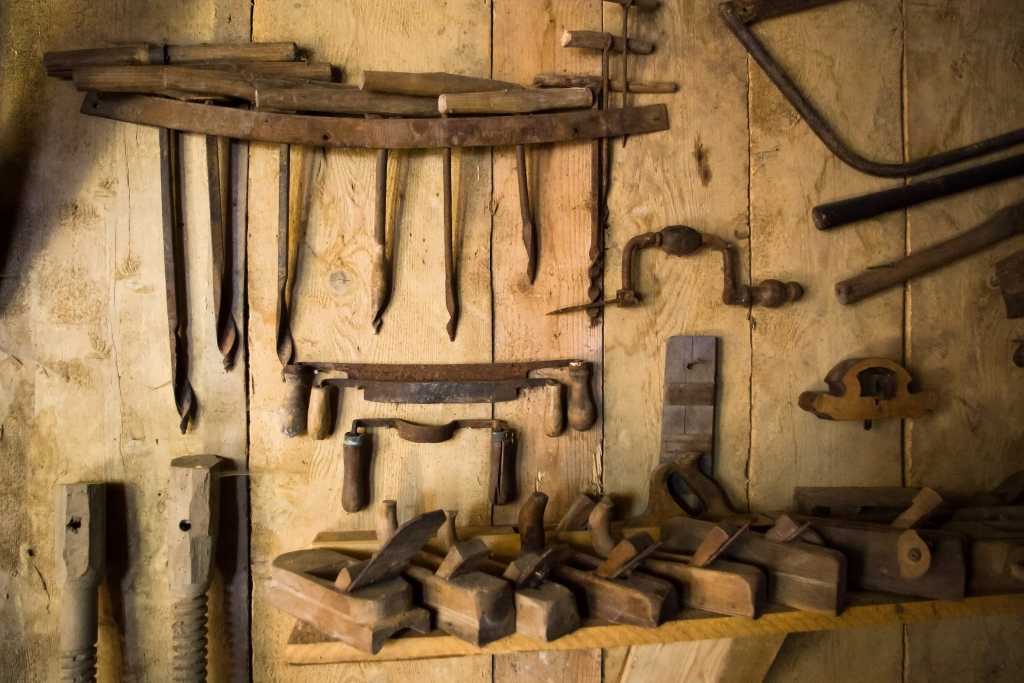 An ode to craftsmanship in software development shutterstock 77260183 rusty old woodworking tools on the wall of an old workshop