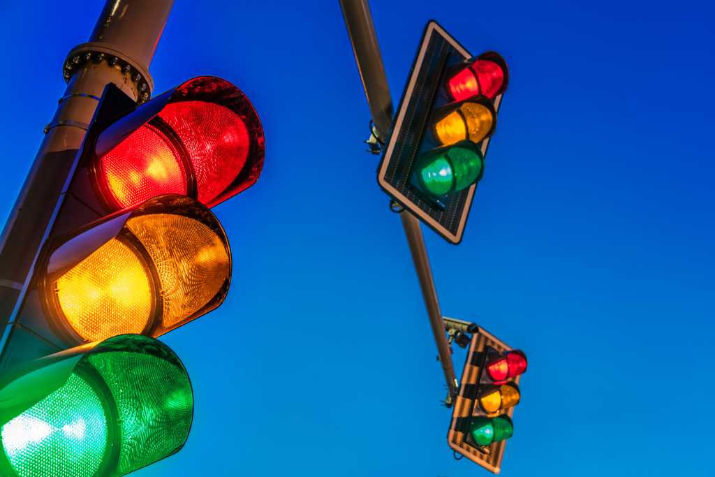 Angular Signal Forms: From event pipelines to signal-driven state shutterstock 1801533685 multiple overhead traffic lights against an evening sky