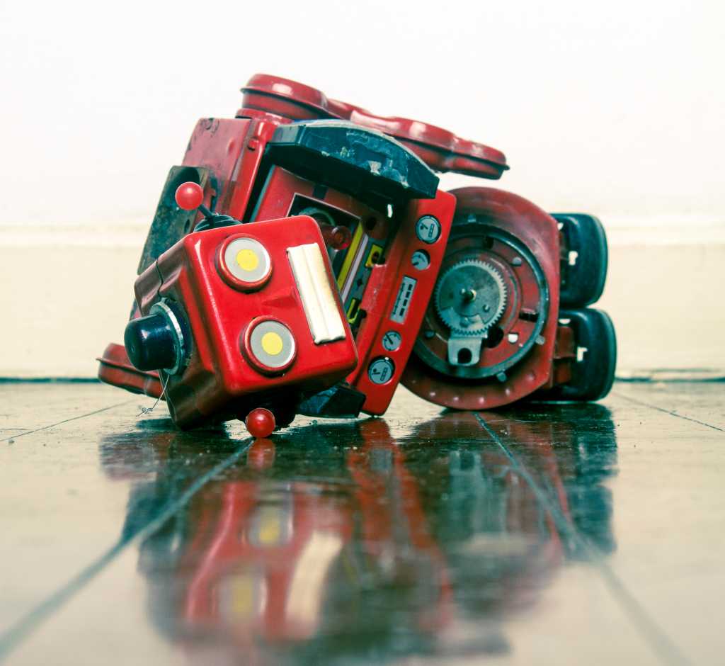 Why most AI agents disappoint in production (and what to fix first) robot wars red robot defeated on old wooden floor
