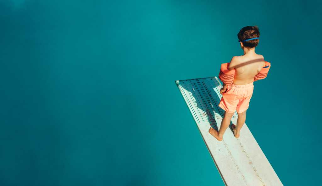 Angular Signals in practice: Building a signal-first form in Angular Top view of boy standing on spring board learning to dive during swimming class on a summer day. Boy learning swimming at outdoor pool.