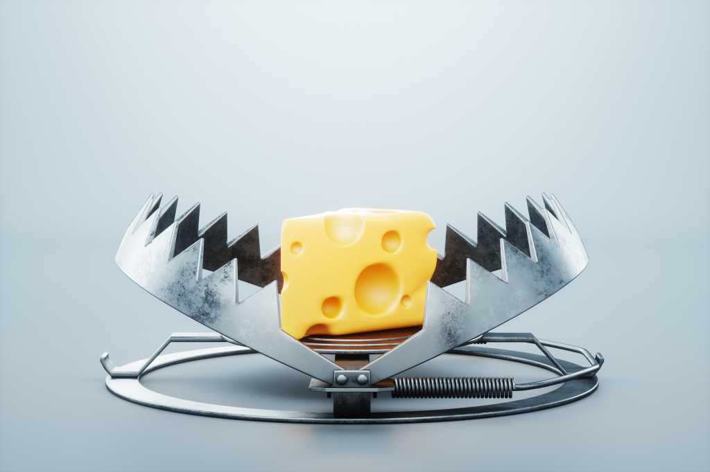 Beware of the genAI token trap A large piece of cheese in a bear trap, close-up. The concept of a trap, cheating, credit, free cheese in a mousetrap. 3D render, 3D illustration