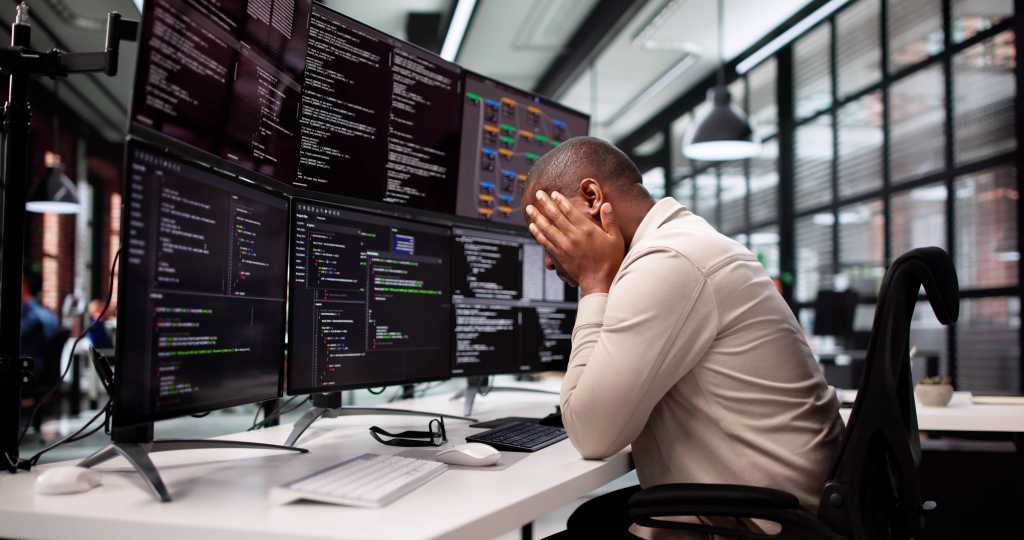 Why cloud outages are such a stubborn problem Unhappy Programmer Caught In Maze Of Broken Software And Stress.